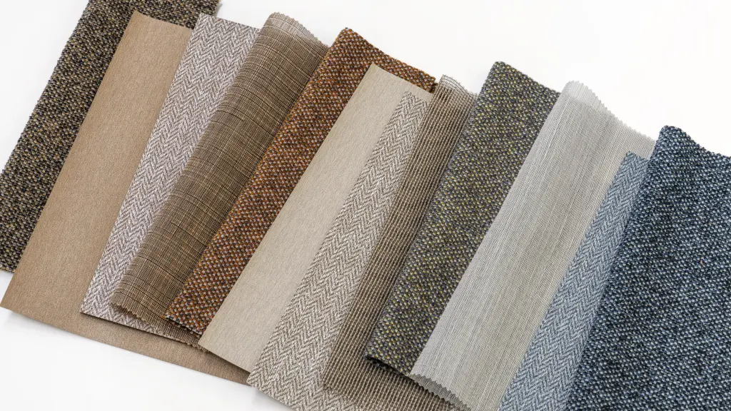 Vescom sample pack featuring sheer curtain fabrics, vinyl wallcoverings and upholstery fabrics with recycled content, arranged in complementary colours and textures.
