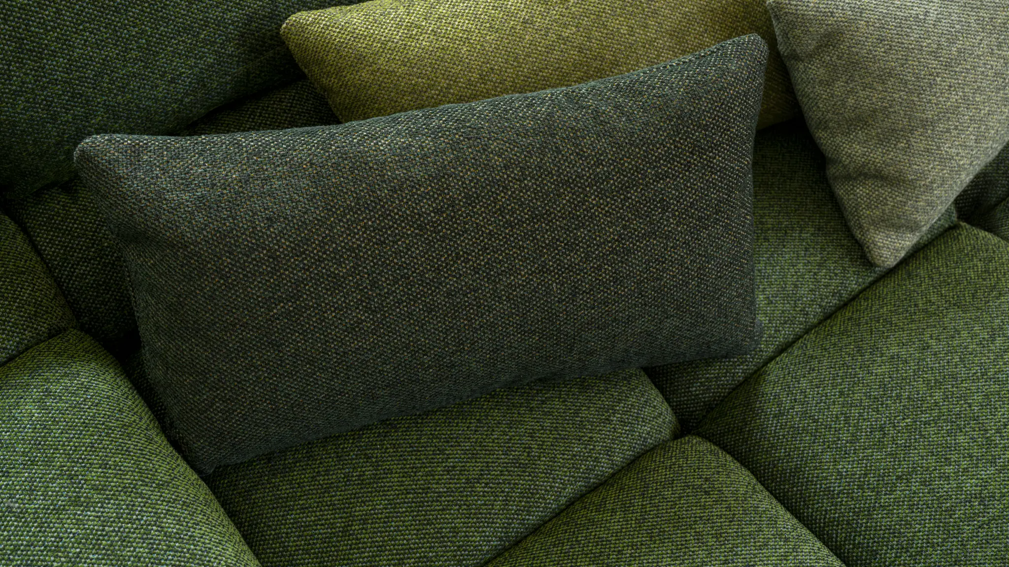 Deep green Vescom Bosco upholstery with a dense, moss-like softness.