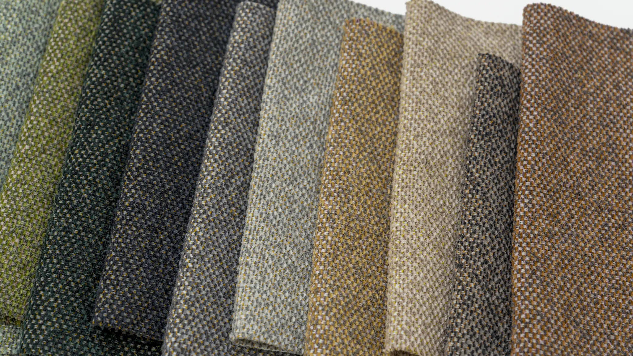 Deep Vescom Bosco upholstery shades with richly flecked melange effects.