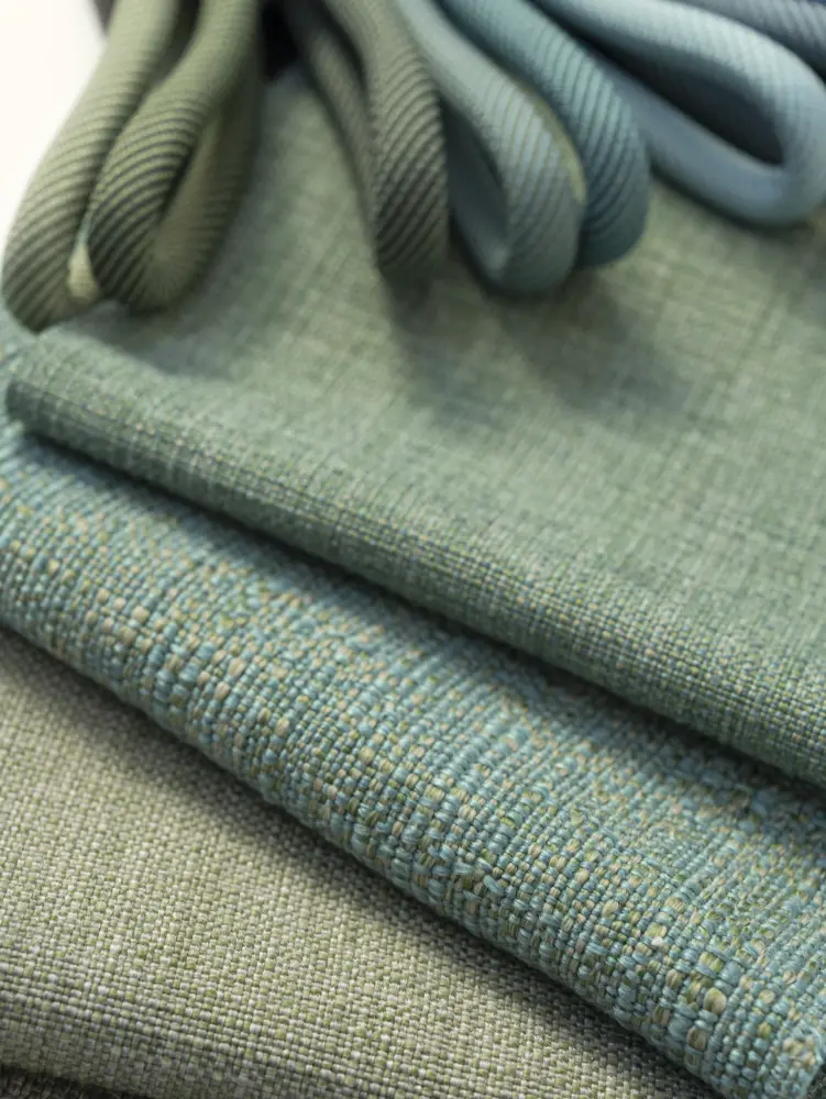 Laguna & Ba upholstery fabric by Vescom in green tones with open irregular structure