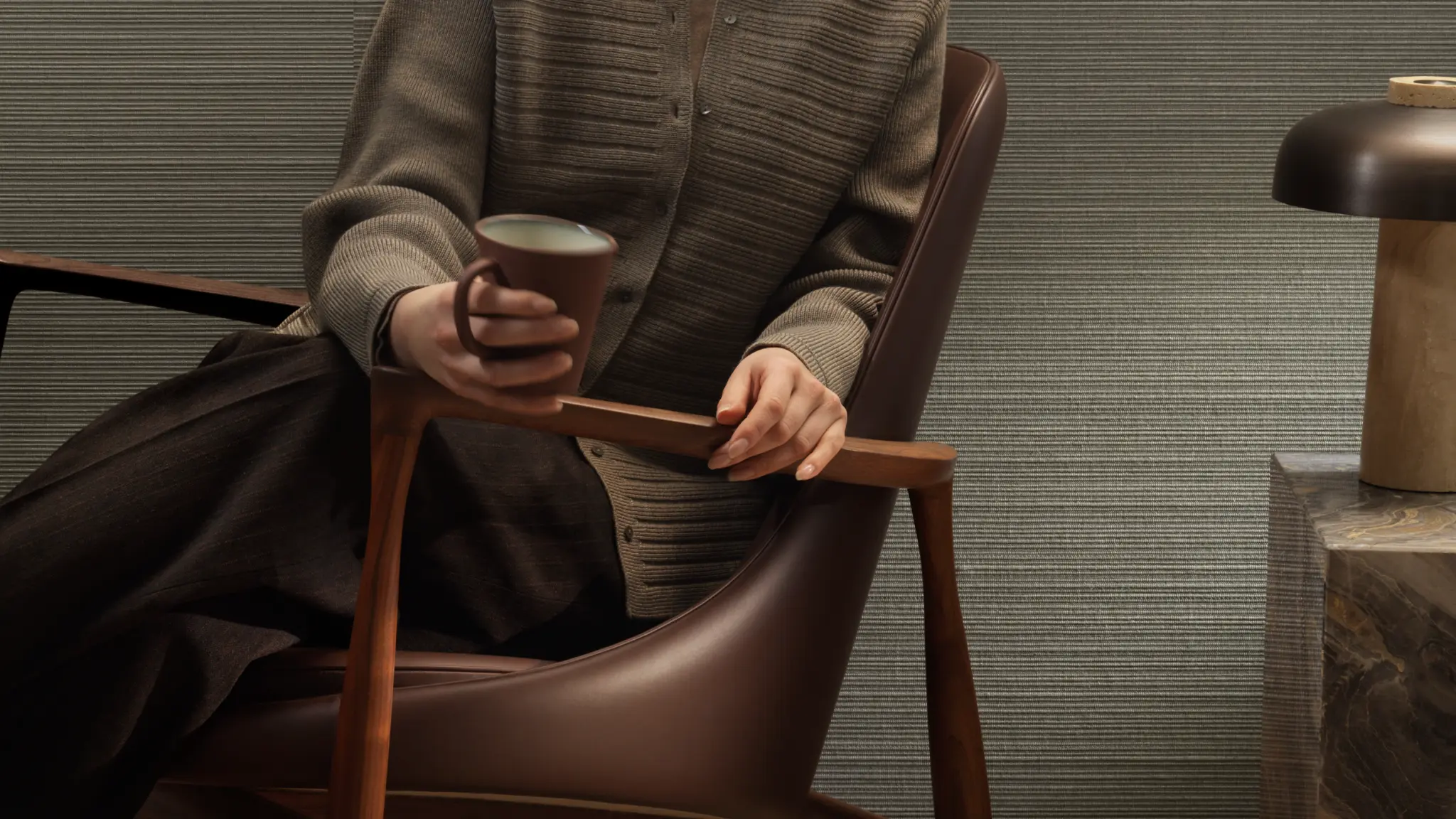 Vescom Forte textile wallcovering with a horizontal yarn structure, creating a rib effect, shown on interior walls in a refined lounge setting