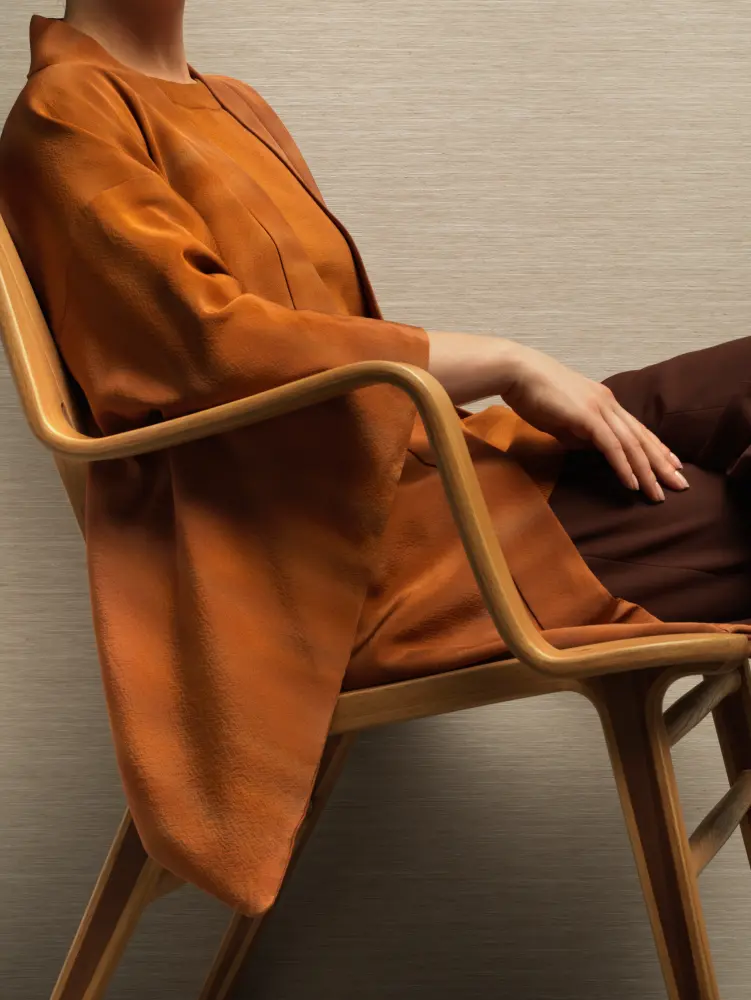 Vescom Ilara textile wallcovering with a crafted horizontal woven texture and subtle tonal variation, shown on interior walls in a refined seating setting