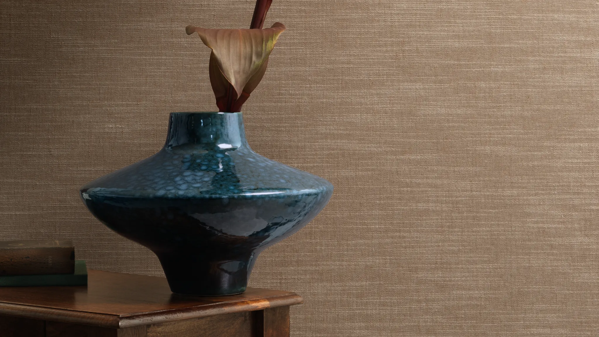 “Vescom Nivelis textile wallcovering with a two-tonal woven horizontal structure and subtle melange effect, shown on interior walls behind a styled wooden table with a ceramic vase and floral stem