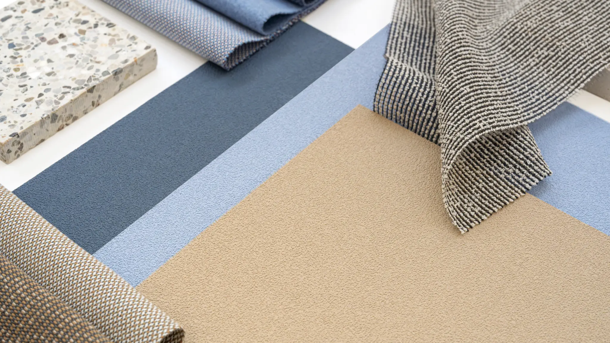 Vescom Colour Choice Blue Breeze vinyl wallcovering collage with denim blue shades and layered materials