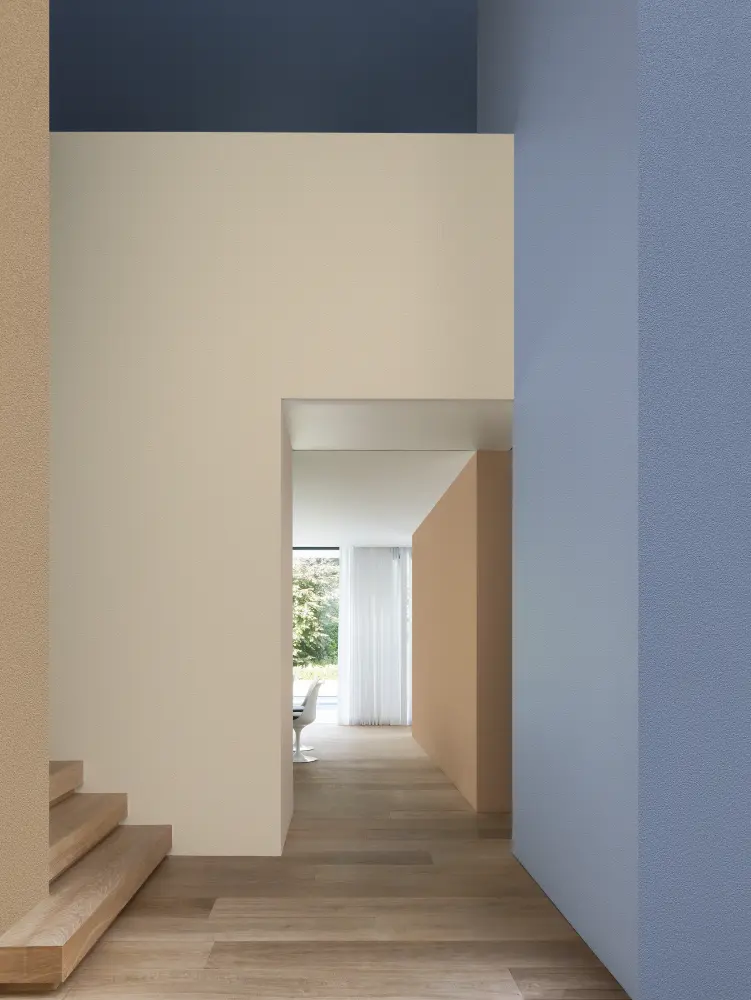 Vescom Colour Choice Blue Breeze vinyl wallcovering in an interior with soft blue tones and natural daylight