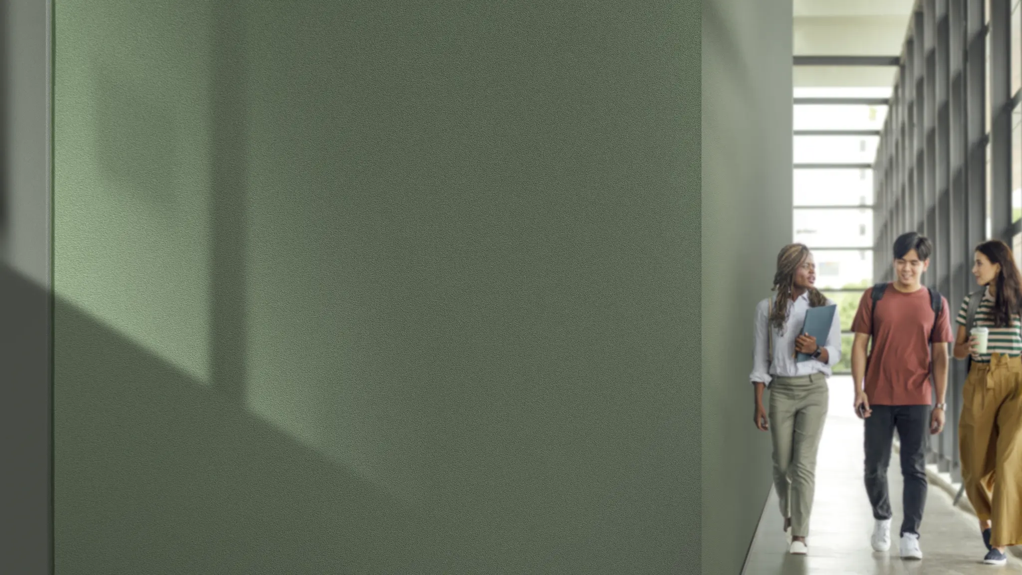 Vescom Colour Choice vinyl wallcovering in a school corridor with green walls and natural light