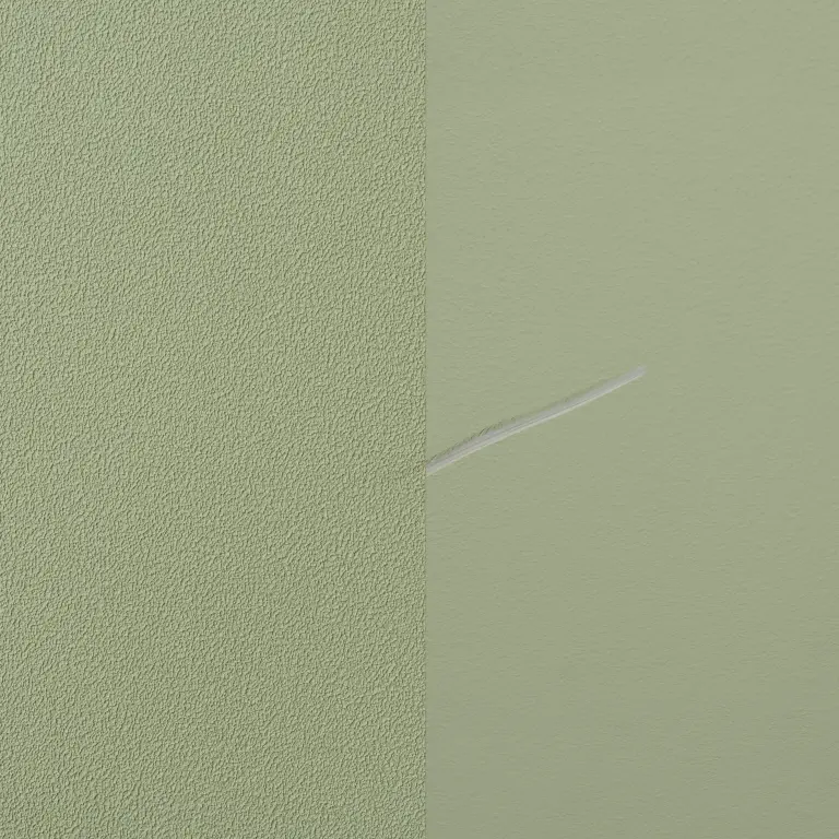Vescom Colour Choice vinyl wallcovering showing scratch resistance with a visible mark comparing painted wall and protected surface