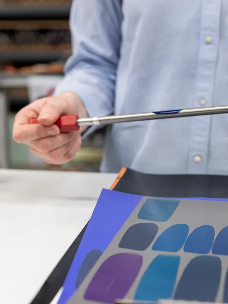 Vescom Colour Choice custom colour development with a person mixing paint to match a specific shade