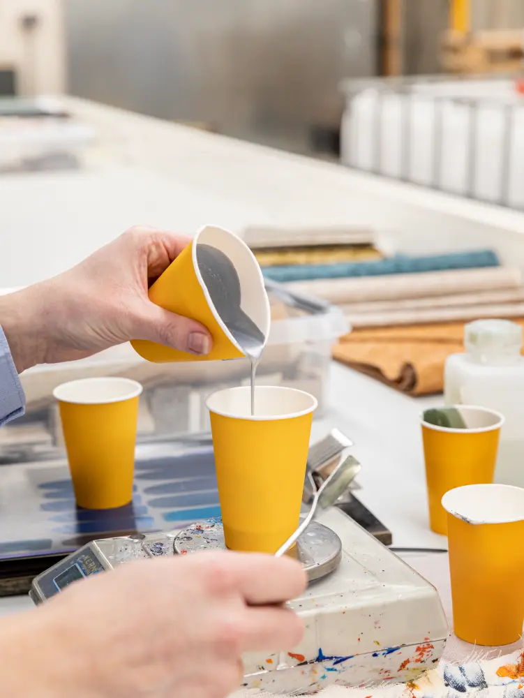 Vescom Colour Choice custom colour process with a person blending different tones to create a precise colour