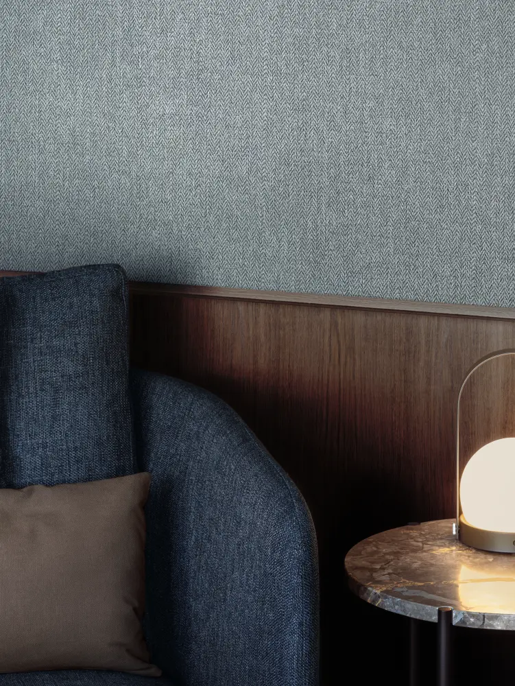 Vescom Harrison vinyl wallcovering creating a soft, refined backdrop in a calm seating area.