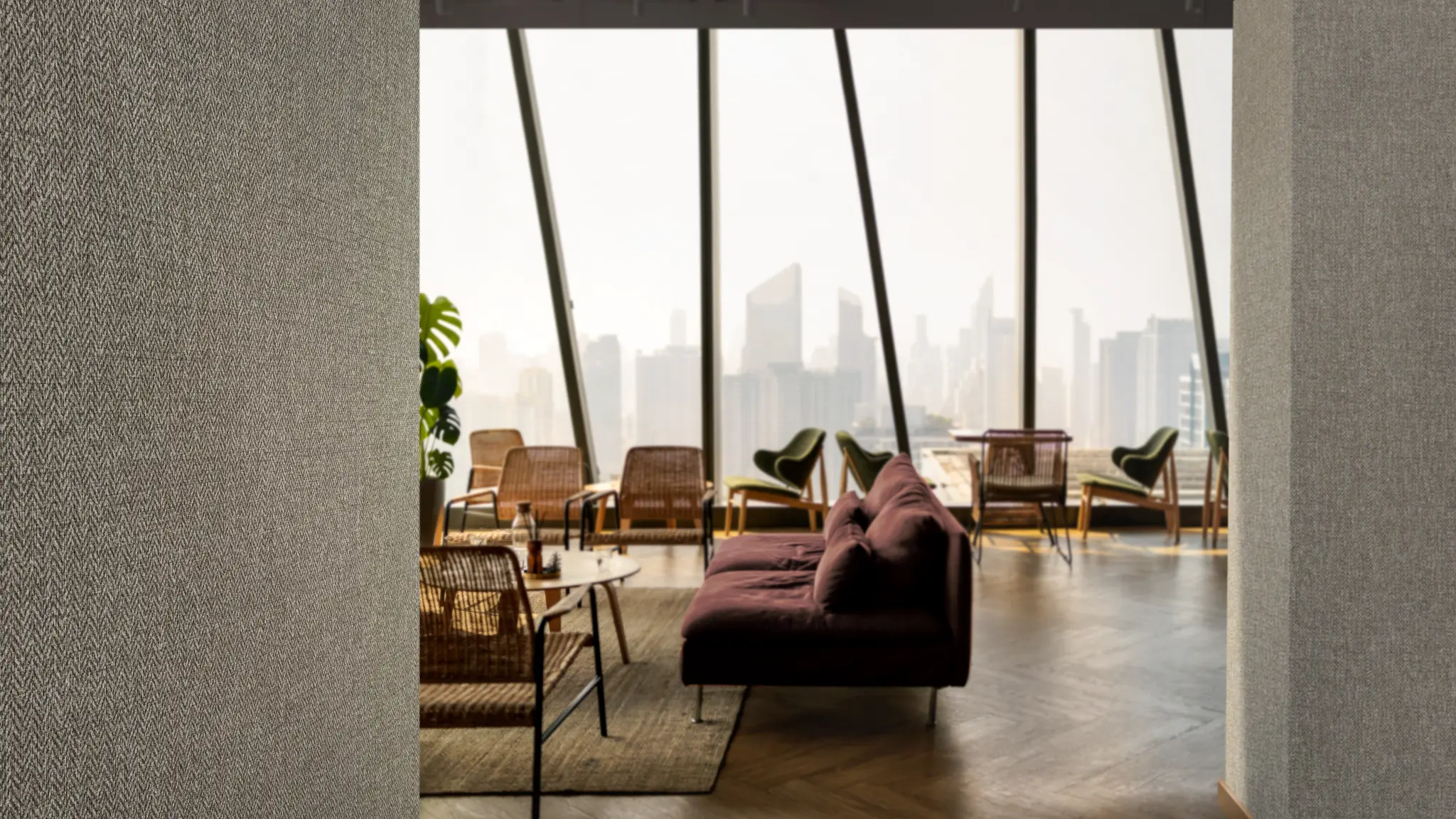 Vescom Harrison wallcovering used in a hospitality interior with warm lighting and a tailored sense of comfort.