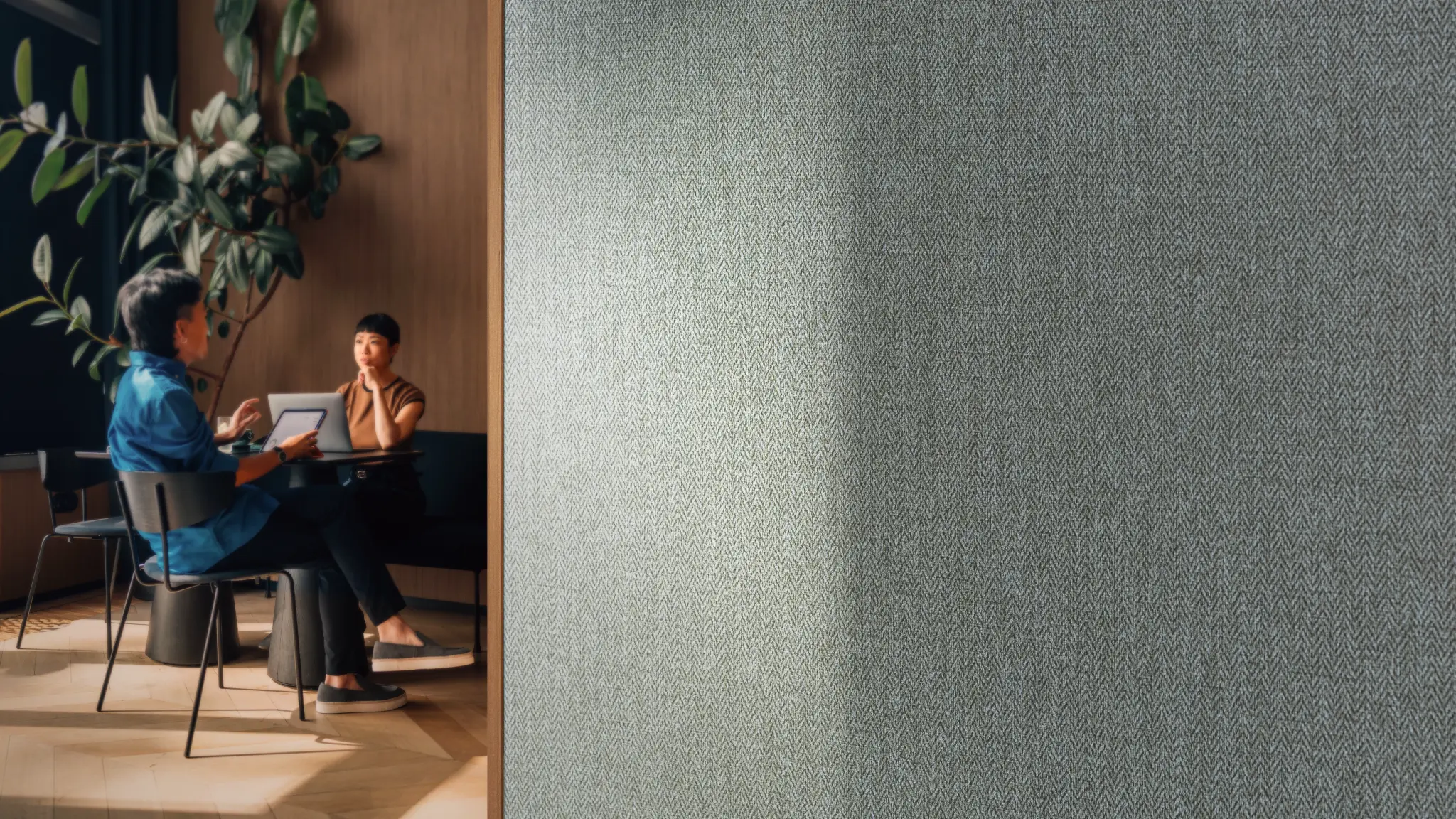 Vescom Harrison vinyl wallcovering with a deep herringbone texture, shown as a grounding surface in an interior setting.