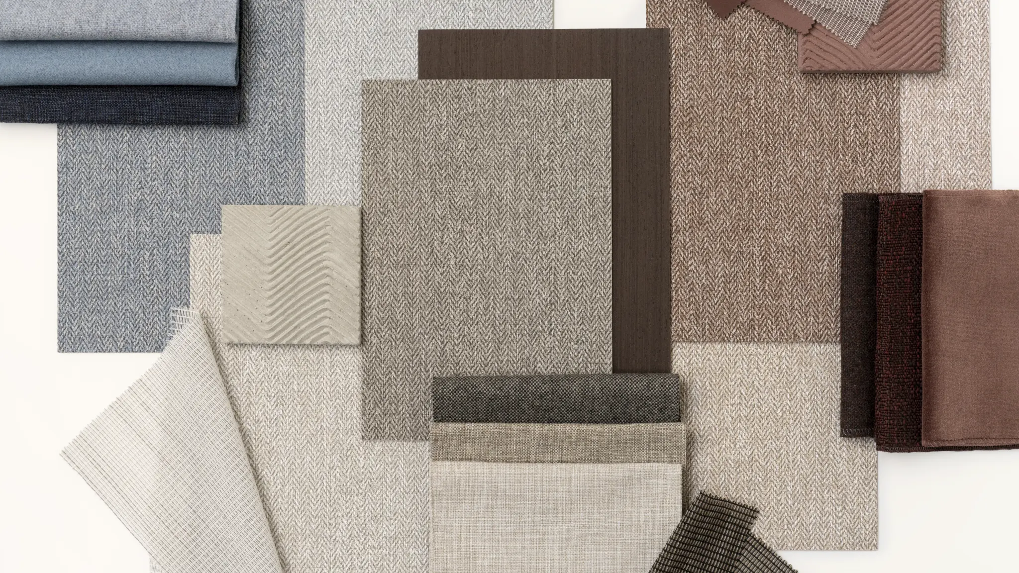 Vescom Harrison moodboard with herringbone vinyl wallcovering samples, colour cards and tailored material references.