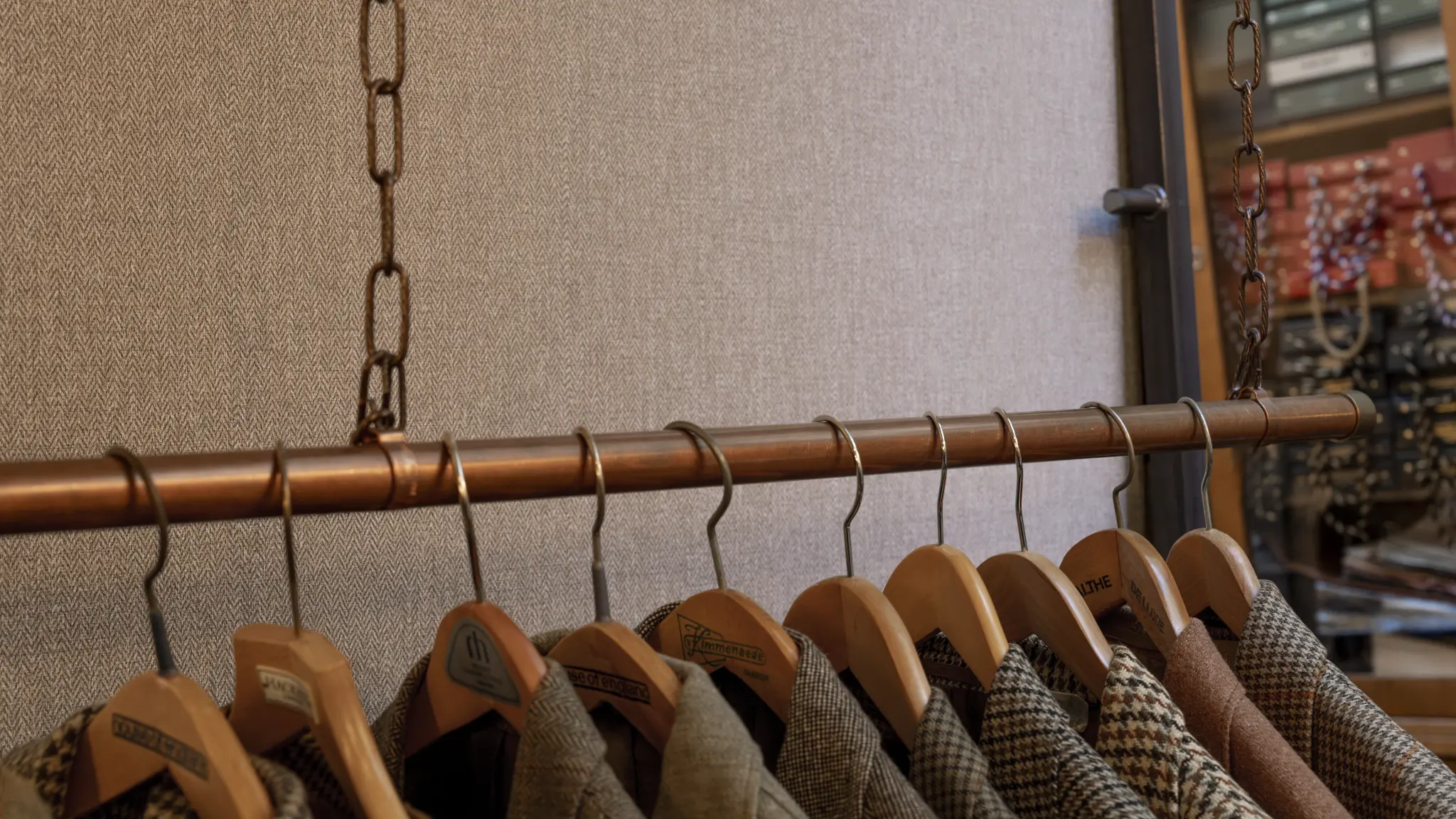 Vescom Harrison inspiration image with classic tailoring references and woollen herringbone material details.