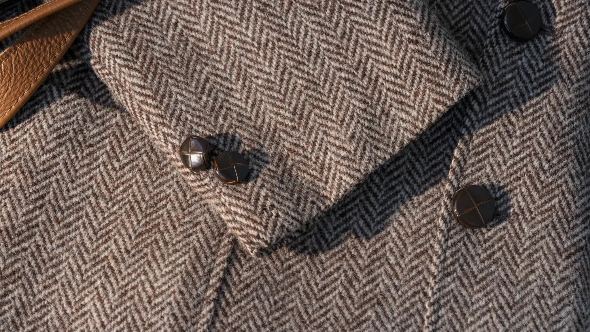Close-up of herringbone fabric texture reflecting the woollen look and feel of Vescom Harrison.