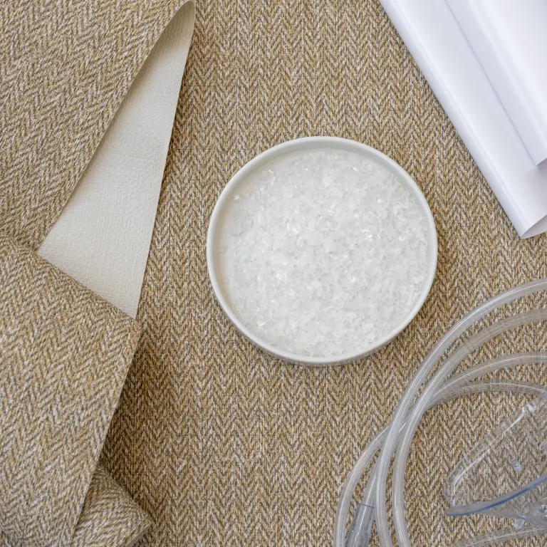 Vescom Harrison recycled vinyl wallcovering sample with plastic medical waste used to create recycled content.