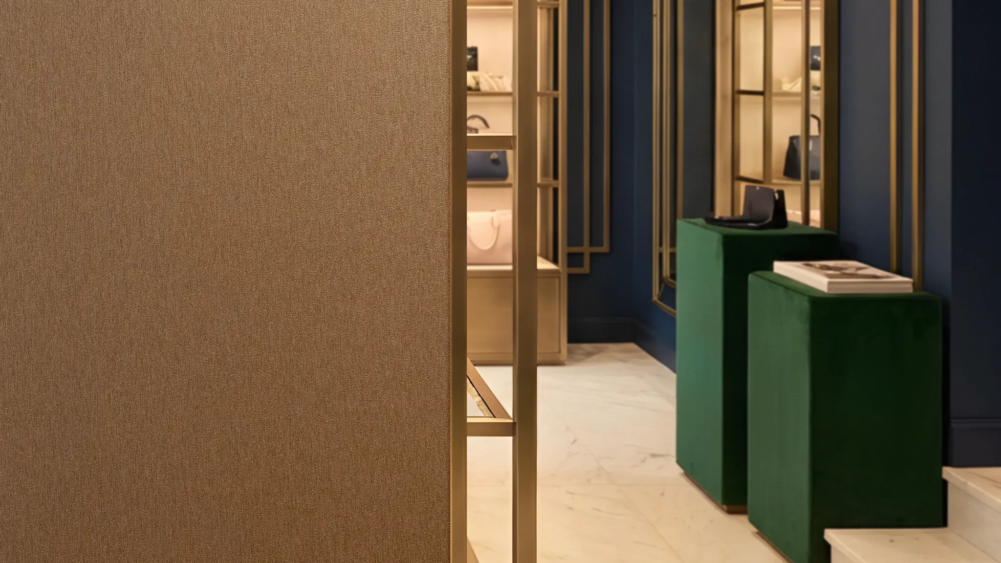 Vescom Stellar wallcovering detail showing a warm brushed metal look in an interior setting.