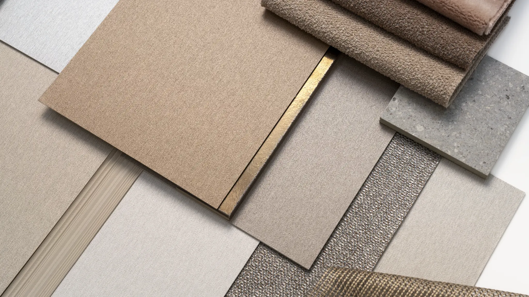 Vescom Stellar material palette with warm neutral samples and soft metallic wallcovering textures.