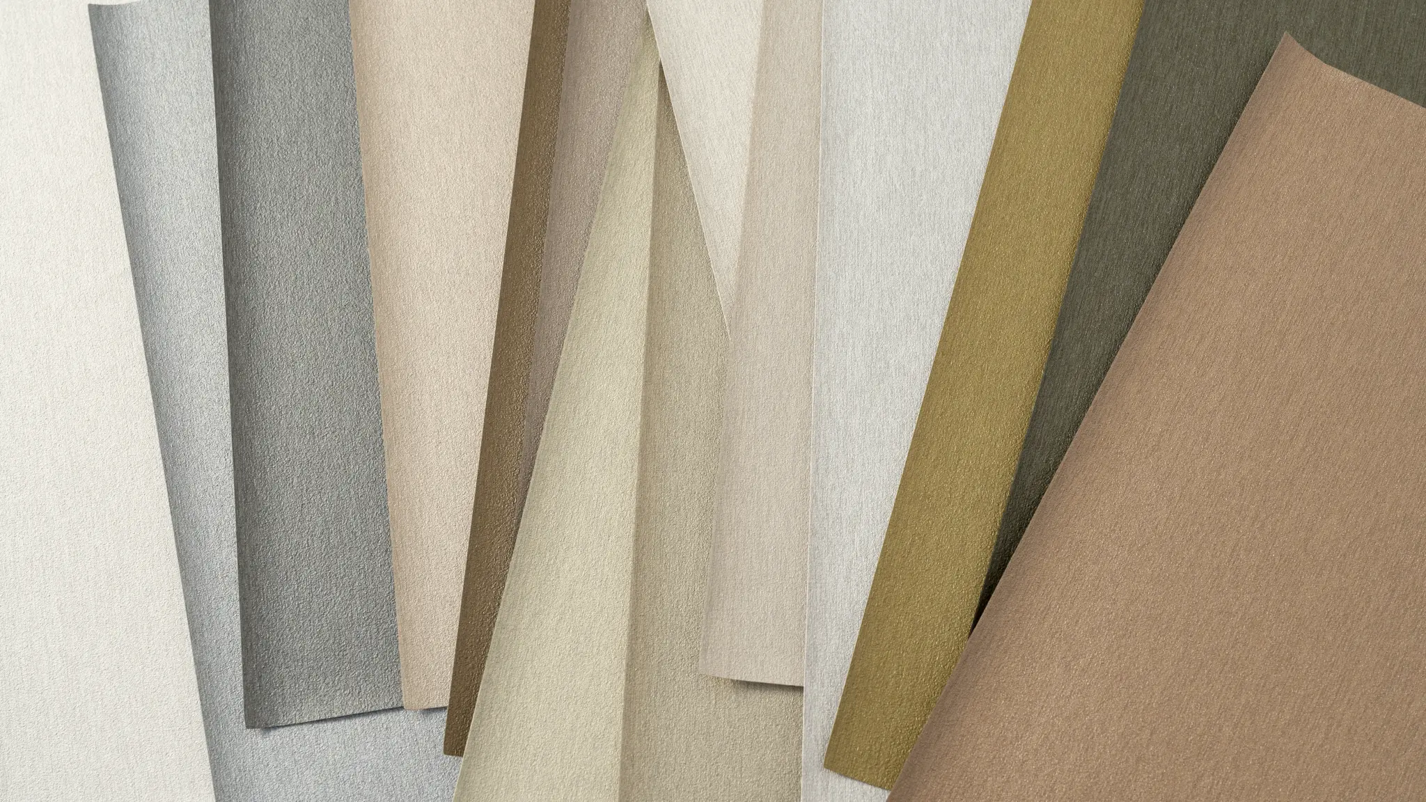 Vescom Stellar vinyl wallcovering colour range with warm neutrals, muted metallic shades and refined mineral hues.