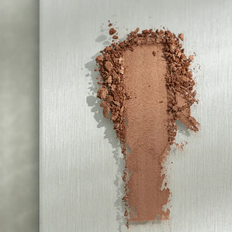 Hand arranging pigment powders and colour sticks as inspiration for Vescom Stellar’s soft mineral palette.